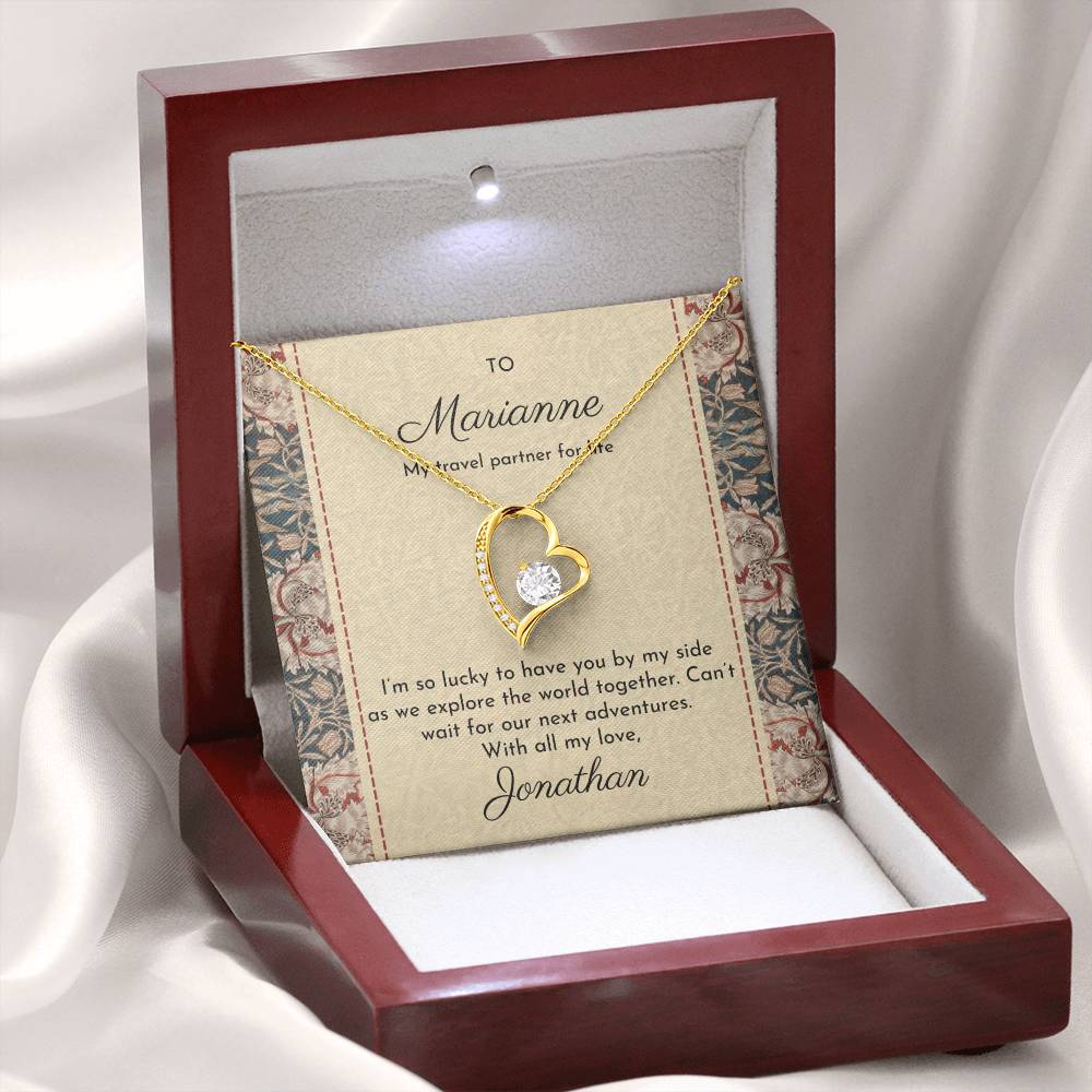 Gold dipped sparkling heart necklace shown in luxury mahogany-style gift box with William Morris 'honeysuckle' design on message card