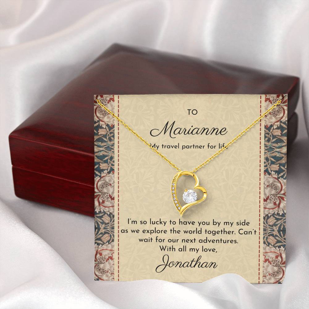 Gold dipped sparkling heart necklace with William Morris 'honeysuckle' design on message card shown next to luxury mahogany-style gift box