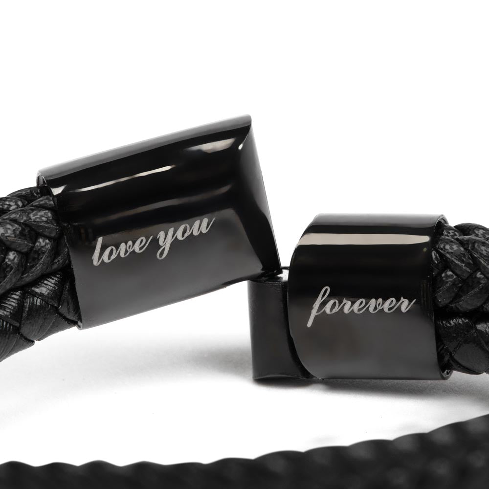 Close-up of vegan leather bracelet clasp showing 'love you forever' engraving