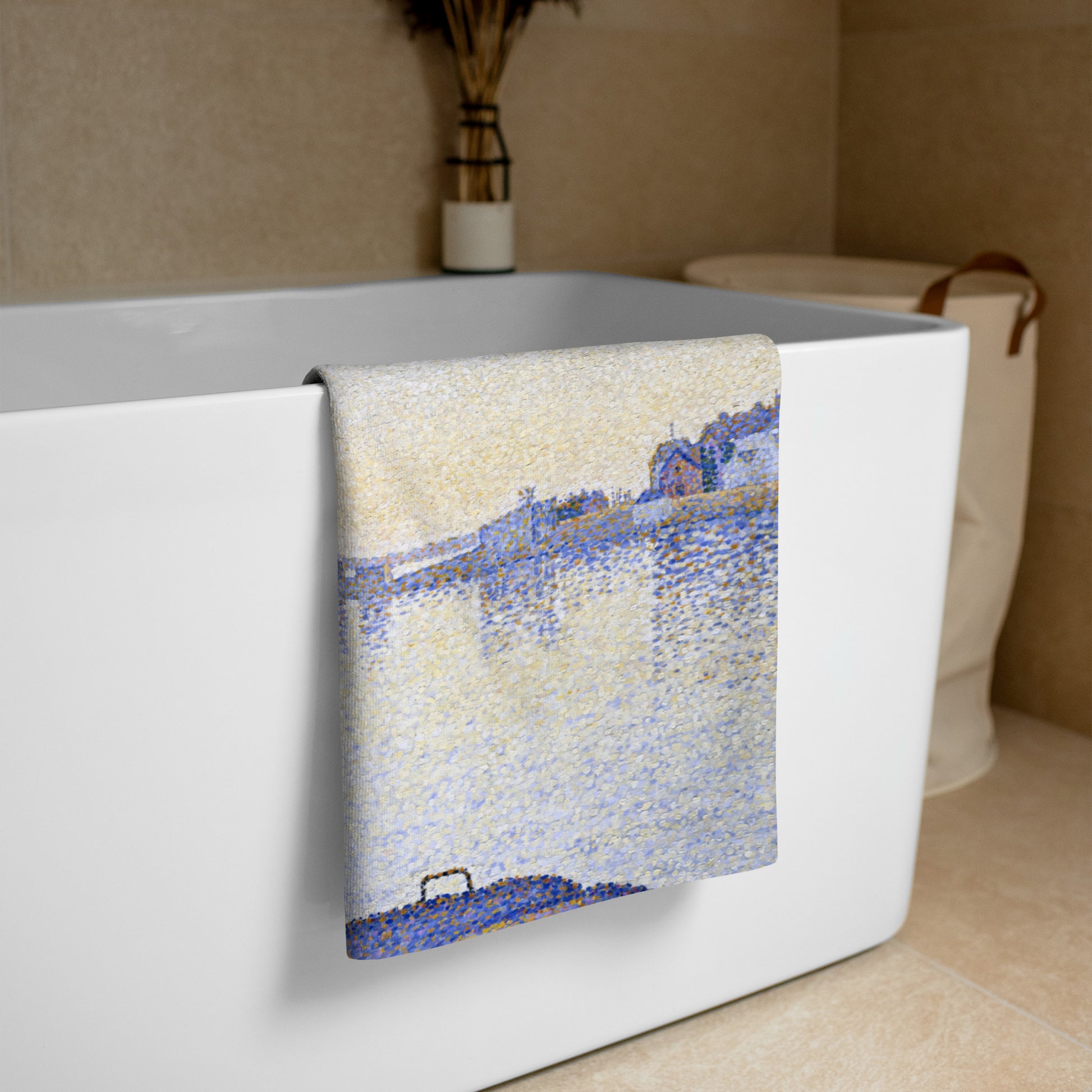 Beach towel featuring painting 'Evening calm, Concarneau' by Paul Signac, hanging over a white bath