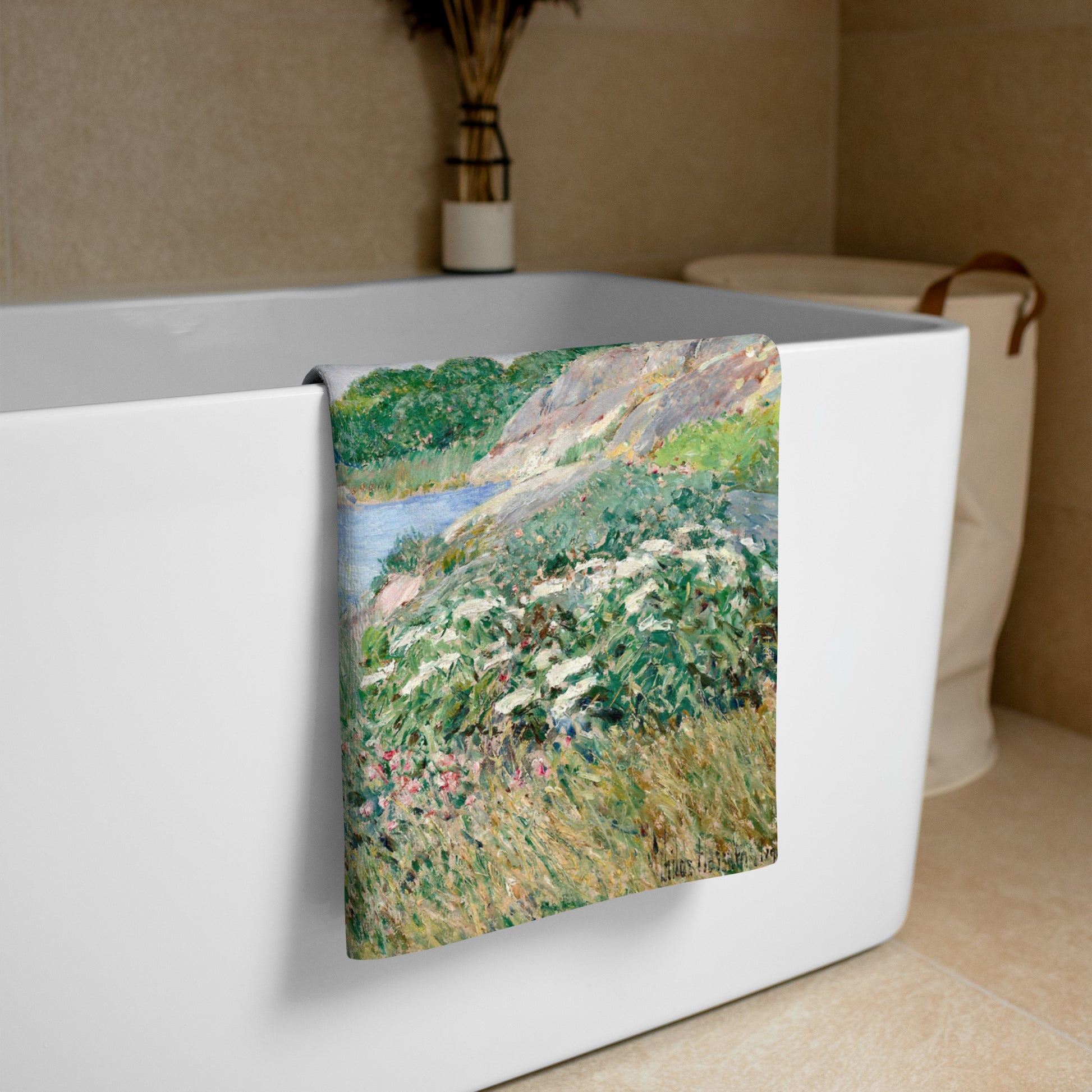 Beach towel featuring painting 'The little pond, Appledore' by Frederick Childe Hassam, hanging over a white bath